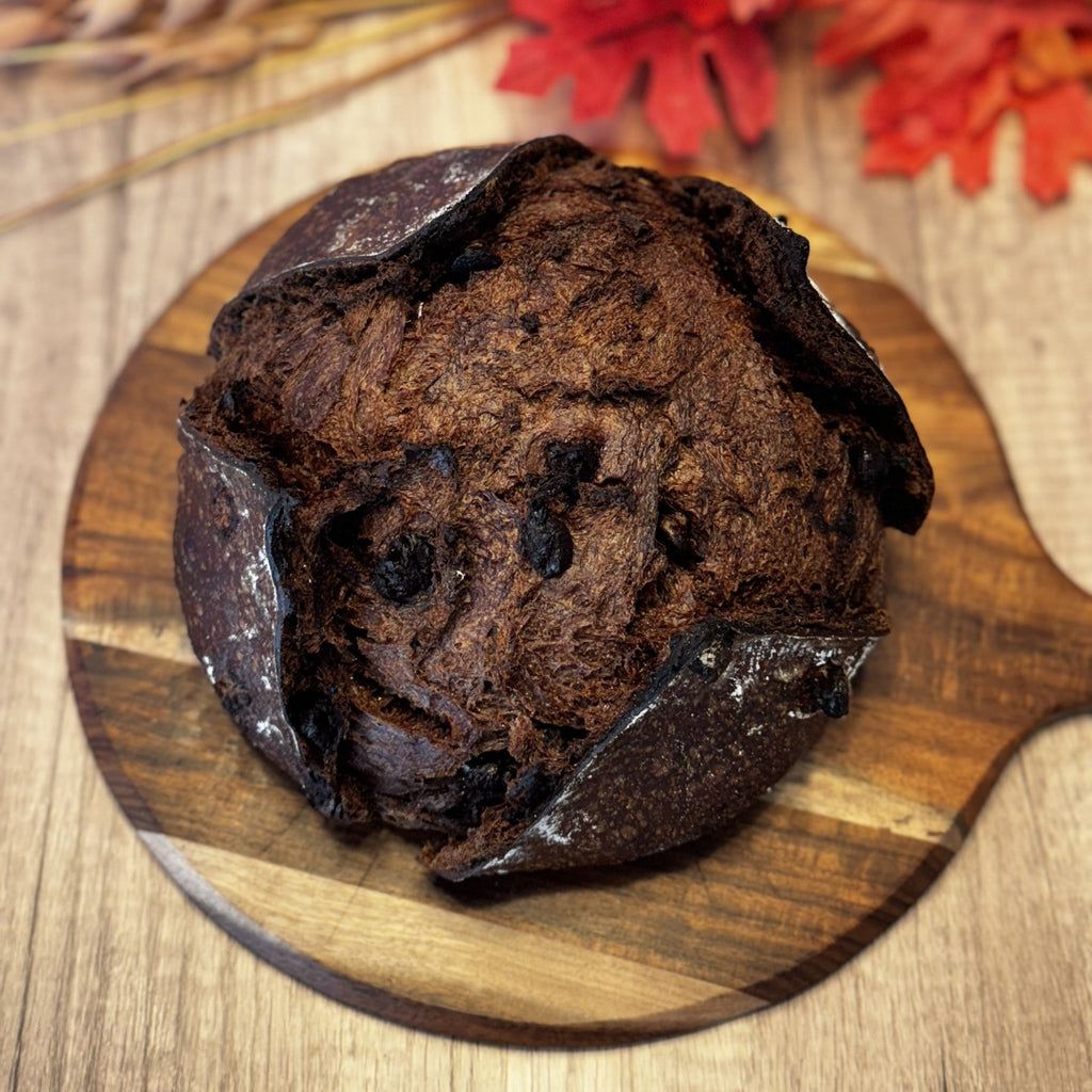 Chocolate sourdough with chocolate chips on a wooden board